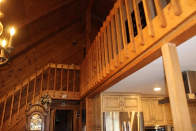 interior space with wood walls and stainless steel appliances