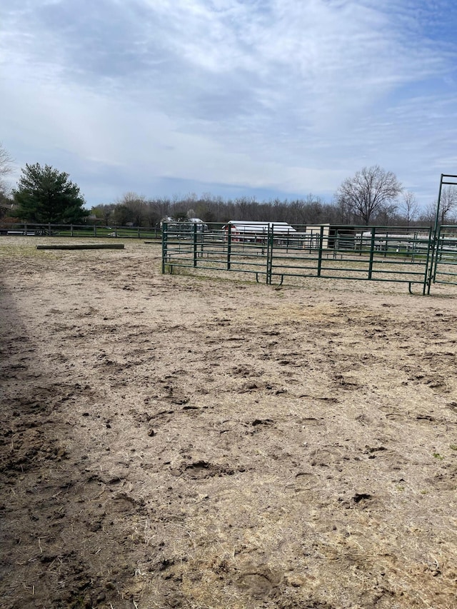 view of yard with a rural view