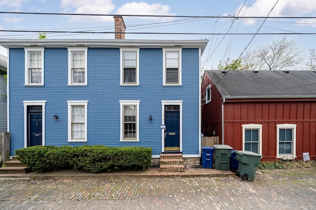 119 Redbud Aly, Columbus, OH 43206 - colonial inspired home featuring a chimney and entry steps