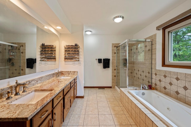 12627 Oakmere Dr, Pickerington, OH 43147 - full bathroom with a shower stall, a tub with jets, double vanity, tile patterned floors, and recessed lighting