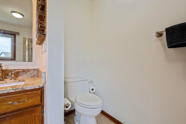 12627 Oakmere Dr, Pickerington, OH 43147 - bathroom with vanity, tile patterned floors, toilet, and baseboards