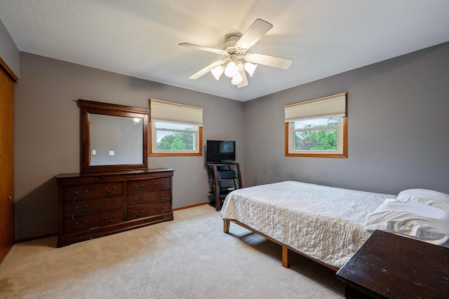 12627 Oakmere Dr, Pickerington, OH 43147 - bedroom with multiple windows, light colored carpet, and ceiling fan
