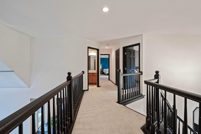 12627 Oakmere Dr, Pickerington, OH 43147 - hallway with an upstairs landing, light carpet, and recessed lighting