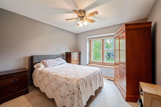 12627 Oakmere Dr, Pickerington, OH 43147 - bedroom with light colored carpet, ceiling fan, and baseboards