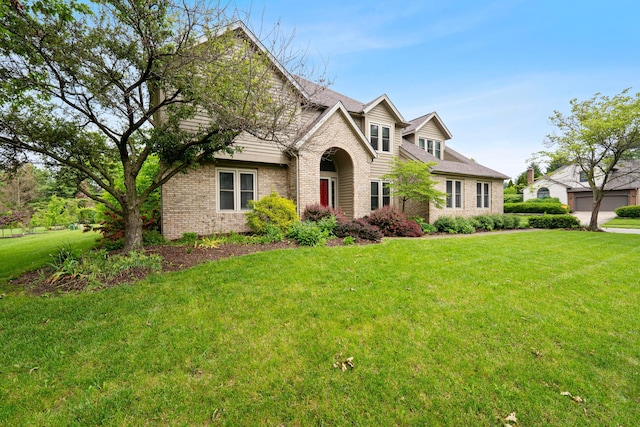 12627 Oakmere Dr, Pickerington, OH 43147 - traditional-style house featuring brick siding and a front yard