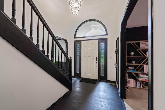 12627 Oakmere Dr, Pickerington, OH 43147 - foyer entrance featuring stairs, a towering ceiling, a chandelier, and baseboards