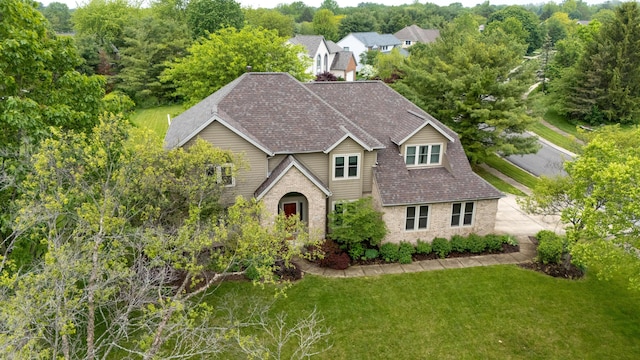 12627 Oakmere Dr, Pickerington, OH 43147 - traditional-style house featuring a front yard, roof with shingles, and brick siding