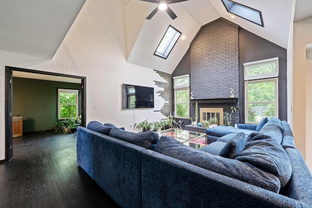 12627 Oakmere Dr, Pickerington, OH 43147 - living area with a skylight, high vaulted ceiling, wood finished floors, a brick fireplace, and ceiling fan
