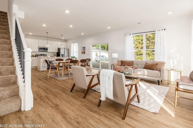 344 Postle Blvd, Columbus, OH 43228 - living room featuring light wood-style flooring, recessed lighting, and stairs