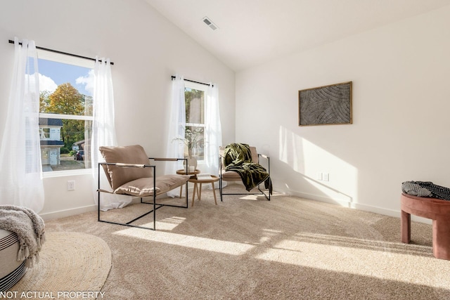 344 Postle Blvd, Columbus, OH 43228 - living area with visible vents, baseboards, high vaulted ceiling, and carpet flooring
