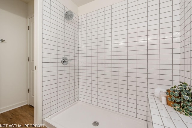 344 Postle Blvd, Columbus, OH 43228 - bathroom with tiled shower and wood finished floors