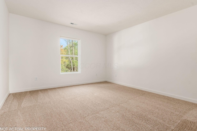 344 Postle Blvd, Columbus, OH 43228 - carpeted spare room featuring a textured ceiling, baseboards, and visible vents