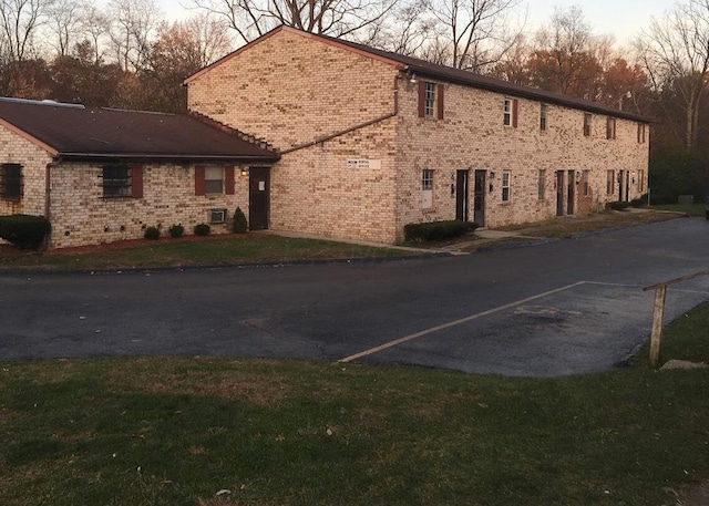 view of property exterior at dusk