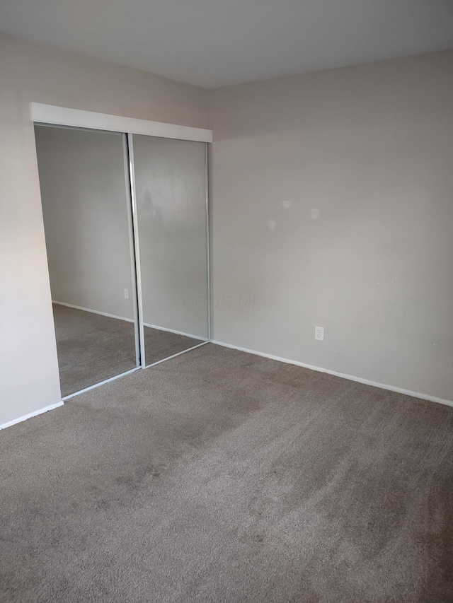 4714 Tarryton Ct S Unit 20-1G, Columbus, OH 43228 - unfurnished bedroom featuring carpet and a closet