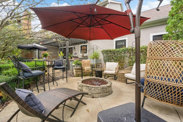 view of patio / terrace featuring a fire pit