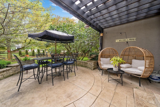 view of patio / terrace featuring fence, a pergola, and outdoor dining area