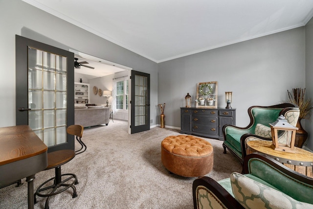 interior space featuring carpet floors, crown molding, french doors, and baseboards