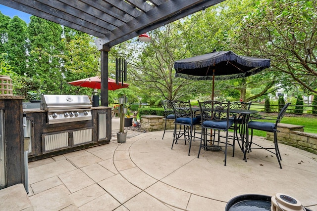 view of patio / terrace with a pergola, fence, an outdoor kitchen, outdoor dining space, and area for grilling