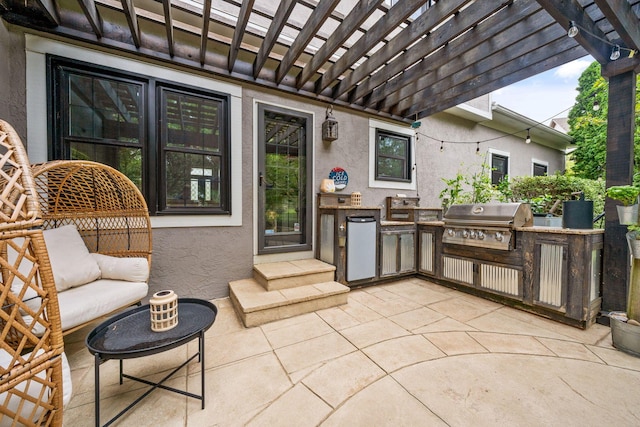 view of patio featuring a pergola, an outdoor kitchen, and a grill