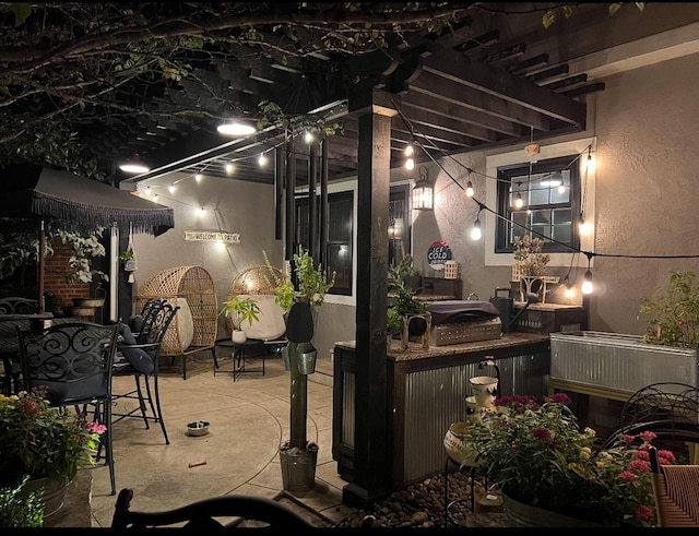 patio at night with outdoor dining area