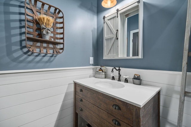 bathroom with wainscoting and vanity