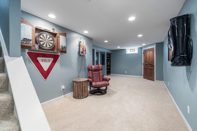 sitting room featuring baseboards, carpet, and recessed lighting