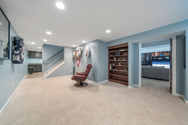 interior space with light colored carpet, baseboards, and recessed lighting