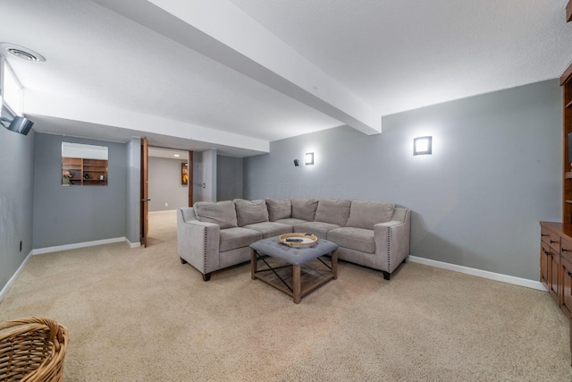 living room featuring baseboards, visible vents, and light colored carpet