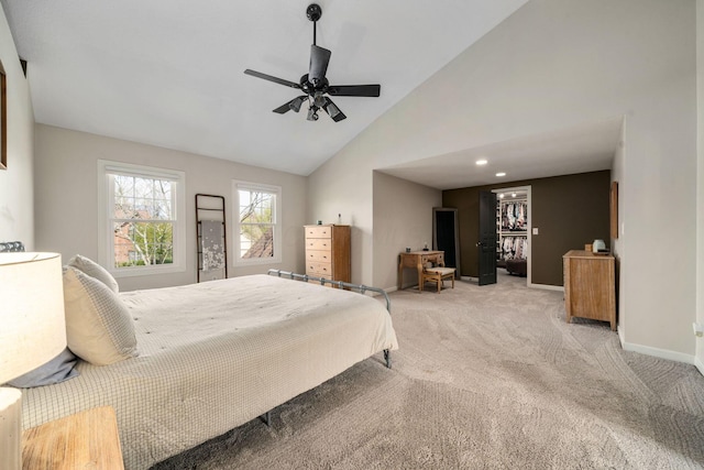 carpeted bedroom with high vaulted ceiling, baseboards, and ceiling fan