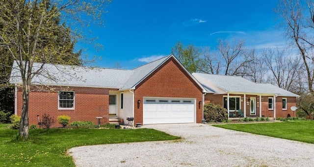 single story home featuring a front lawn and a garage