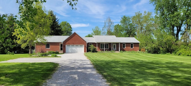 ranch-style home with a front lawn and a garage