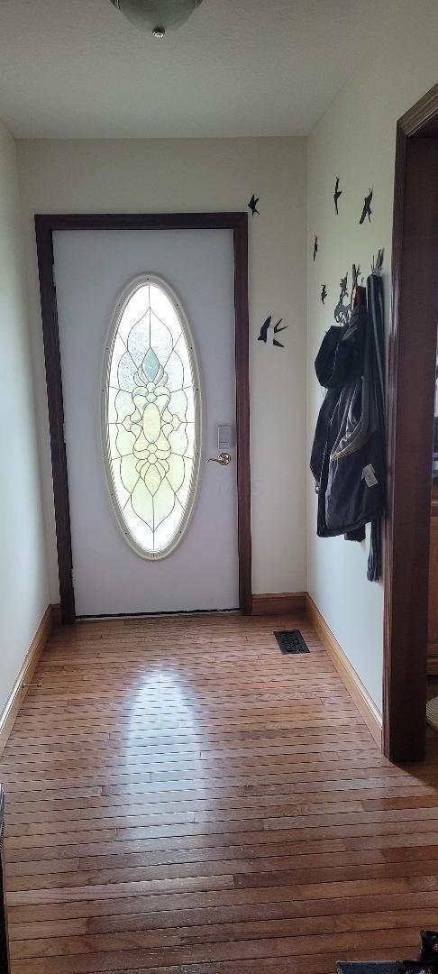 foyer with light hardwood / wood-style flooring