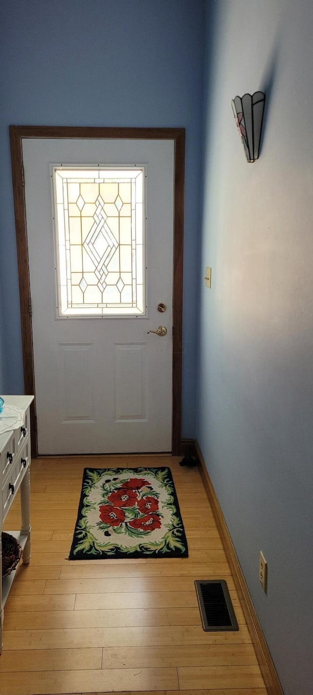 doorway with light hardwood / wood-style floors