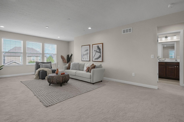 5421 Mercier St, Lewis Center, OH 43035 - living area with light carpet, baseboards, and recessed lighting