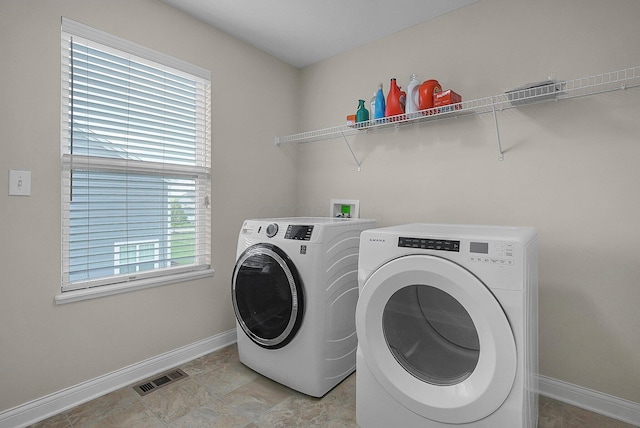 5421 Mercier St, Lewis Center, OH 43035 - laundry room featuring independent washer and dryer, plenty of natural light, and baseboards