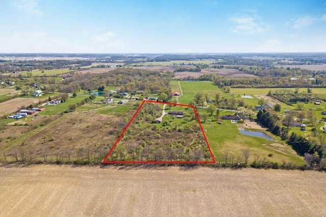 aerial view with a rural view and a water view