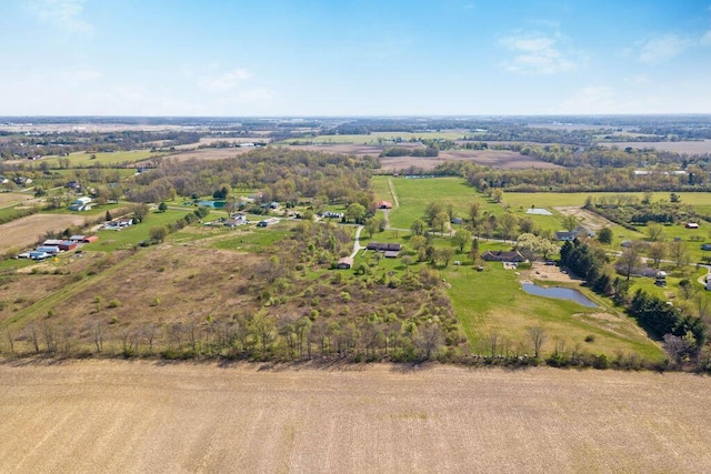 drone / aerial view with a water view and a rural view