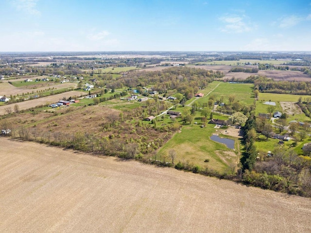 birds eye view of property featuring a rural view