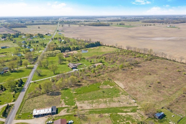 birds eye view of property featuring a rural view