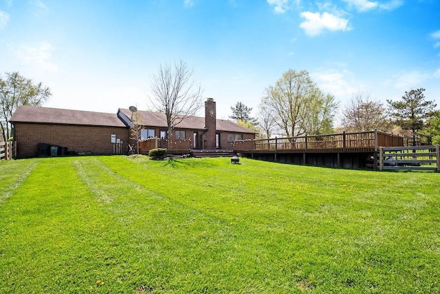 view of yard featuring a wooden deck