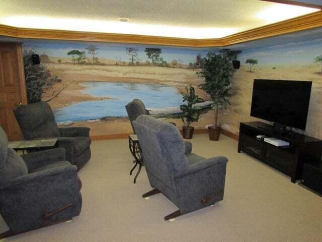 living room with a raised ceiling and crown molding