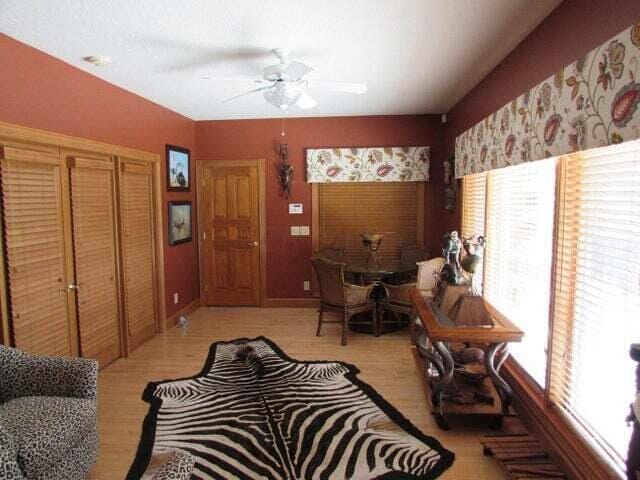 interior space with ceiling fan and light hardwood / wood-style flooring