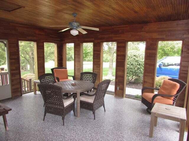 sunroom / solarium featuring ceiling fan and wooden ceiling