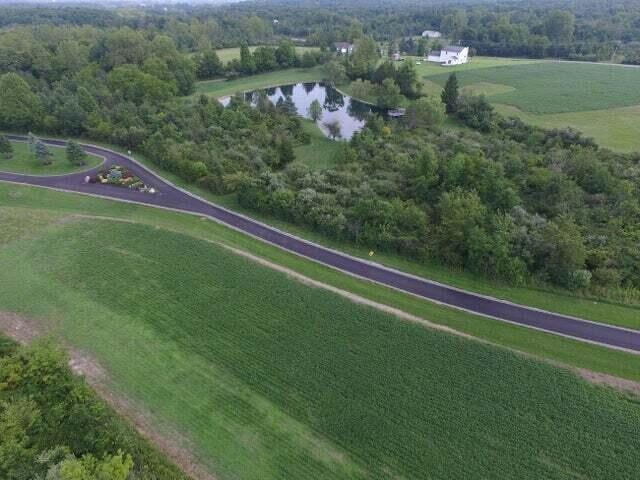 aerial view with a rural view and a water view