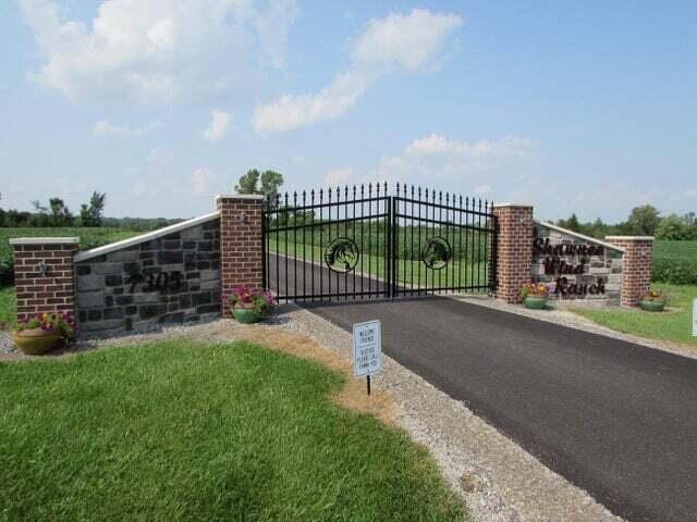 view of gate featuring a yard