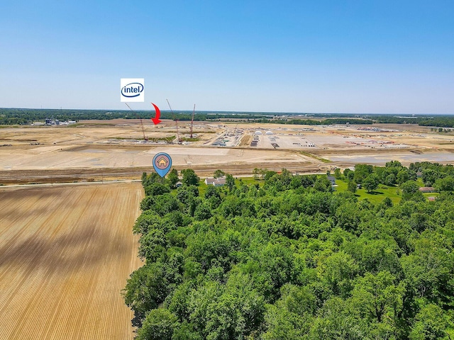 birds eye view of property with a rural view