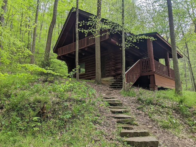23411 State Route 327, Laurelville, OH 43135 - back of house featuring stairway, a deck, log exterior, and a wooded view