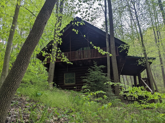 view of side of home with a wooden deck