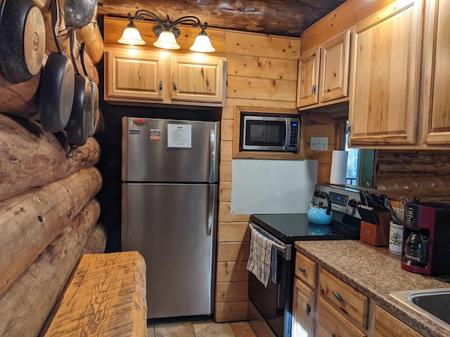 kitchen featuring stainless steel appliances and wood walls