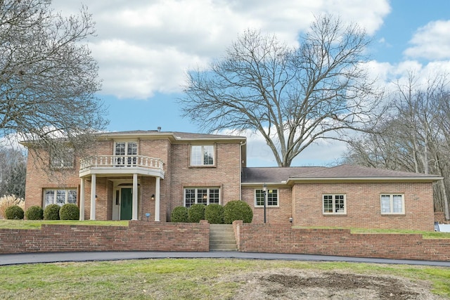 view of front of house with a balcony